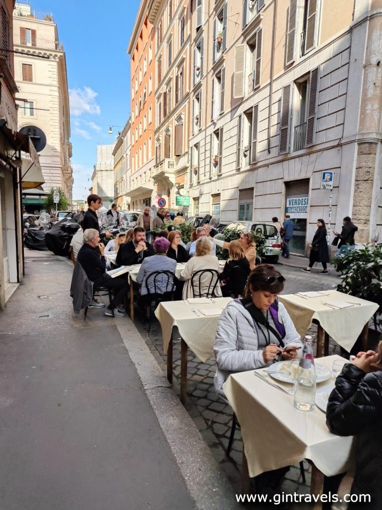 People eating in street restaurant